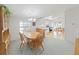 Cozy dining area featuring a chandelier, natural light, and access to the kitchen at 1746 Fox Hill Dr, Lakeland, FL 33810