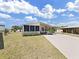 Well-maintained single-story home with a convenient covered carport and a cozy screened-in porch for enjoying the outdoors at 1746 Fox Hill Dr, Lakeland, FL 33810