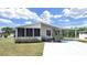Charming single-story home with a screened-in porch and covered carport offering comfort and convenience at 1746 Fox Hill Dr, Lakeland, FL 33810