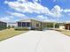 Inviting single-story home with a covered carport and screened-in porch providing ample space for parking and relaxation at 1746 Fox Hill Dr, Lakeland, FL 33810