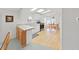 Bright kitchen featuring white cabinets, stainless steel appliances, and a cozy adjacent dining area at 1746 Fox Hill Dr, Lakeland, FL 33810