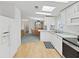 Well-lit kitchen with white cabinets, access to dining area, and clean appliances at 1746 Fox Hill Dr, Lakeland, FL 33810