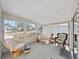 Bright sunroom with lots of natural light and comfortable seating for relaxation and enjoying the outdoor views at 1746 Fox Hill Dr, Lakeland, FL 33810