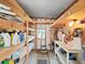 Organized storage room with wooden shelving, tools, and various household items displayed at 1746 Fox Hill Dr, Lakeland, FL 33810