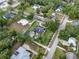 Lovely aerial view of a home nestled among lush green trees and a well-manicured lawn at 195 E Conant St, Bartow, FL 33830