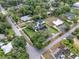 Overhead shot of the property shows surrounding homes and lots in the area with mature, shady trees at 195 E Conant St, Bartow, FL 33830
