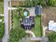 A charming property shows the house, manicured lawn, driveway, neighborhood, and circular pool in backyard at 195 E Conant St, Bartow, FL 33830