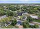 Gorgeous aerial view of a neighborhood offering homes surrounded by lush trees and green grass at 195 E Conant St, Bartow, FL 33830