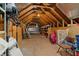 Unfinished attic with exposed wooden beams and supports, plus storage options at 195 E Conant St, Bartow, FL 33830