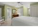 Inviting bedroom with connecting bath, plush carpet, and roomy closets at 195 E Conant St, Bartow, FL 33830
