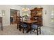 Spacious dining room area featuring wooden furniture, floral décor, and soft lighting at 195 E Conant St, Bartow, FL 33830