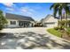 A bright, spacious home shows off a garage and connected carport with awning, perfect for hosting guests at 195 E Conant St, Bartow, FL 33830