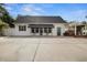 Spacious garage with an adjacent brick outdoor grill area at 195 E Conant St, Bartow, FL 33830