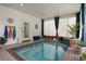 Indoor pool area with lots of natural light and space for relaxation at 195 E Conant St, Bartow, FL 33830