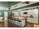 Beautiful kitchen with a large island, white cabinetry, stainless steel appliances, and hardwood flooring at 195 E Conant St, Bartow, FL 33830