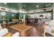 Open concept kitchen and living area featuring an island with bar seating and stainless steel appliances at 195 E Conant St, Bartow, FL 33830