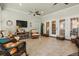 Bright living room offering tile flooring, natural light, and comfortable seating at 195 E Conant St, Bartow, FL 33830