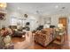 Bright living space showcasing a fireplace, comfortable seating, and hardwood floors at 195 E Conant St, Bartow, FL 33830
