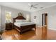 Bright main bedroom with hardwood floors, stylish furniture, and ample closet space at 195 E Conant St, Bartow, FL 33830