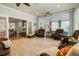Sunroom featuring wicker and leather seating, tile floors, and lots of natural light at 195 E Conant St, Bartow, FL 33830
