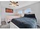 A neat bedroom features modern paint colors and is filled with light, creating a bright and inviting atmosphere at 2020 Bassedena W Cir, Lakeland, FL 33805