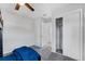This bedroom includes a closet, ceiling fan, and access to the bathroom at 2020 Bassedena W Cir, Lakeland, FL 33805