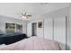 The bedroom's decor includes clean, modern color schemes, neutral wall colors, and ample closet space at 2020 Bassedena W Cir, Lakeland, FL 33805