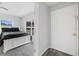 A calm bedroom features gray walls, white trim, and a plush bed, filled with natural light at 2020 Bassedena W Cir, Lakeland, FL 33805