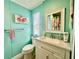 Bright bathroom with modern fixtures, granite countertop, and colorful floral shower curtain at 2055 S Floral Ave # 11, Bartow, FL 33830