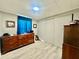 Bedroom with wood-look flooring, closet, and a dresser for ample storage space at 2055 S Floral Ave # 11, Bartow, FL 33830