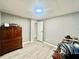 Bedroom with wood-look flooring, and a dresser for ample storage space at 2055 S Floral Ave # 11, Bartow, FL 33830