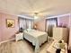Cozy bedroom features wood-look flooring and a ceiling fan for comfortable living at 2055 S Floral Ave # 11, Bartow, FL 33830
