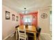 Bright dining room with a wooden table, chandelier, and decorative wall art at 2055 S Floral Ave # 11, Bartow, FL 33830