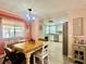 Open floor plan from dining area to kitchen with modern appliances and decor at 2055 S Floral Ave # 11, Bartow, FL 33830