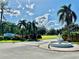 Community entrance with water fountain, tropical landscaping and a private entrance at 2055 S Floral Ave # 11, Bartow, FL 33830