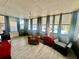 Cozy living room featuring comfortable seating and large windows for natural light at 2055 S Floral Ave # 11, Bartow, FL 33830