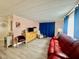 Comfortable living room with hardwood flooring, accent furniture, and bright window at 2055 S Floral Ave # 11, Bartow, FL 33830
