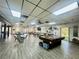 Spacious recreation room with abundant seating, pool table, and lots of natural light at 2055 S Floral Ave # 11, Bartow, FL 33830