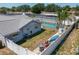 Backyard featuring a pool, storage shed and outdoor equipment behind a privacy fence at 210 Citrus Dr, Winter Haven, FL 33884