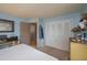Bedroom with a king bed, closet, and view into an ensuite bathroom at 210 Citrus Dr, Winter Haven, FL 33884