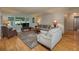 Comfortable living room with large windows, plush seating, a decorative rug, and ample natural light at 210 Citrus Dr, Winter Haven, FL 33884