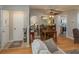 Open-concept living room and dining room with beautiful laminate flooring and neutral color scheme at 210 Citrus Dr, Winter Haven, FL 33884