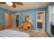 Bedroom featuring a vanity area, walk-in closet, and an ensuite bathroom at 210 Citrus Dr, Winter Haven, FL 33884