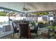 Comfortable covered patio with bar and dining area perfect for outdoor entertaining at 210 Citrus Dr, Winter Haven, FL 33884