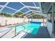 Sparkling screened in pool with updated railings ready for swimming at 210 Citrus Dr, Winter Haven, FL 33884