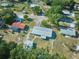 Extensive aerial view displaying the house's location, neighboring houses, and tree coverage at 219 Willow St, Lake Wales, FL 33859