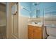 Traditional bathroom features a vanity and shower with beige and blue tile at 219 Willow St, Lake Wales, FL 33859