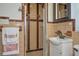 Bathroom featuring vintage brown tile, glass door shower and unique mirror at 219 Willow St, Lake Wales, FL 33859