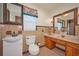 Bathroom featuring vintage brown tile, large vanity, and unique mirror at 219 Willow St, Lake Wales, FL 33859