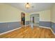 Inviting dining room featuring hardwood floors and an open layout to the kitchen at 219 Willow St, Lake Wales, FL 33859